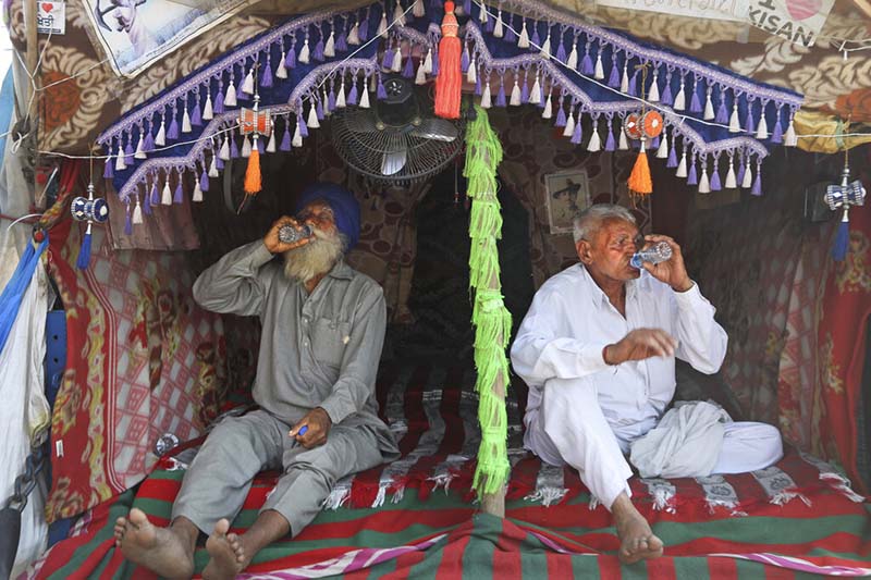 Indian farmers mark 100th day of protest with road blockade