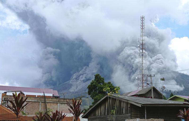 Indonesia’s Sinabung volcano spews ash, hot clouds