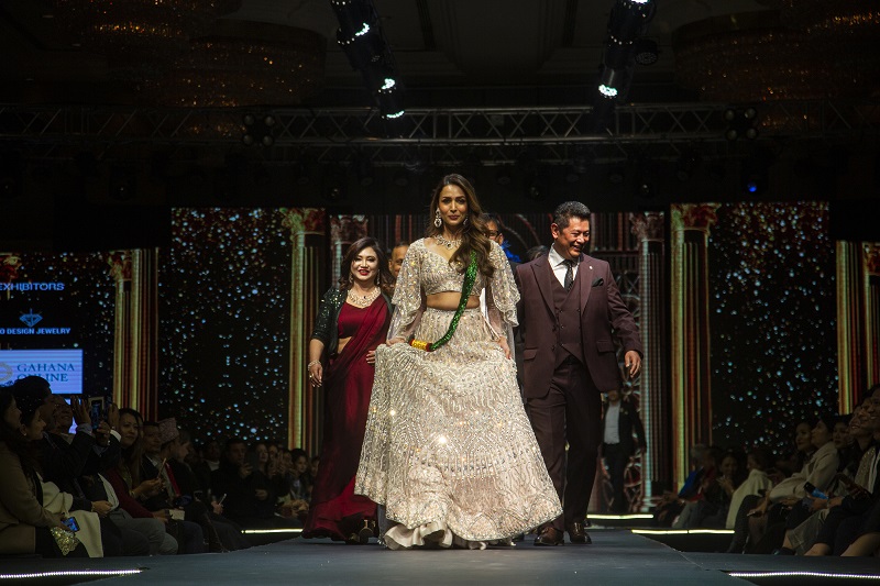 Malaika Arora walks the ramp in ivory lehenga