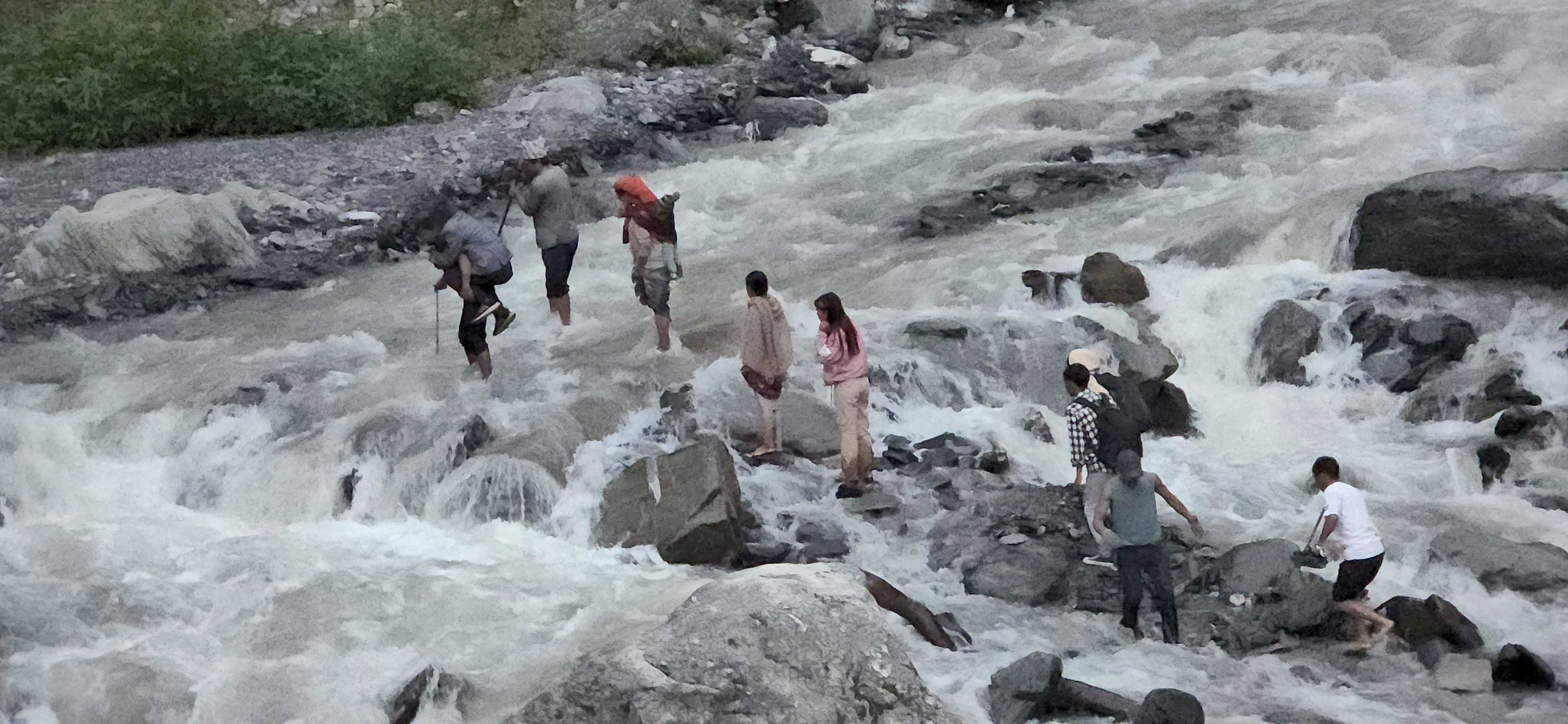 Local residents crossing the river at risk