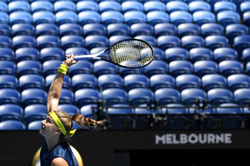 Australian Open goes quiet as lockdown keeps crowds away