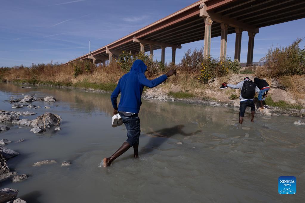 Migrants cross Rio Bravo river in Chihuahua state, Mexico