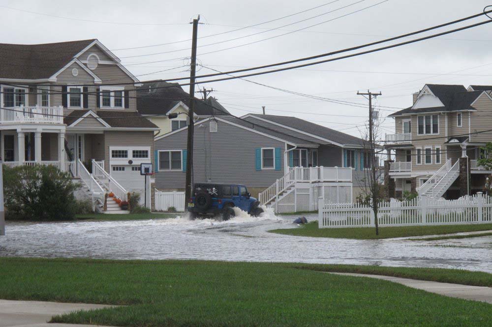 Amid rising seas, ‘dry’ resort is wetter than it likes