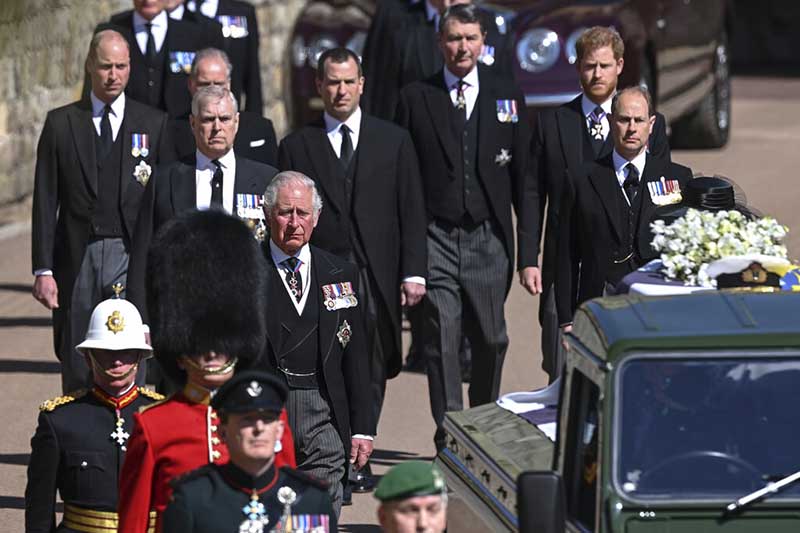 Prince Philip is laid to rest as somber queen sits alone