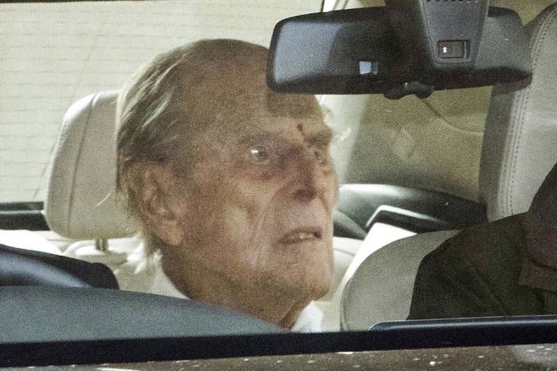 Britain’s Prince Philip returns home after treatment