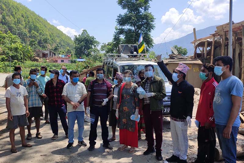 RPP leaders distribute mask, sanitiser to locals in Nuwakot