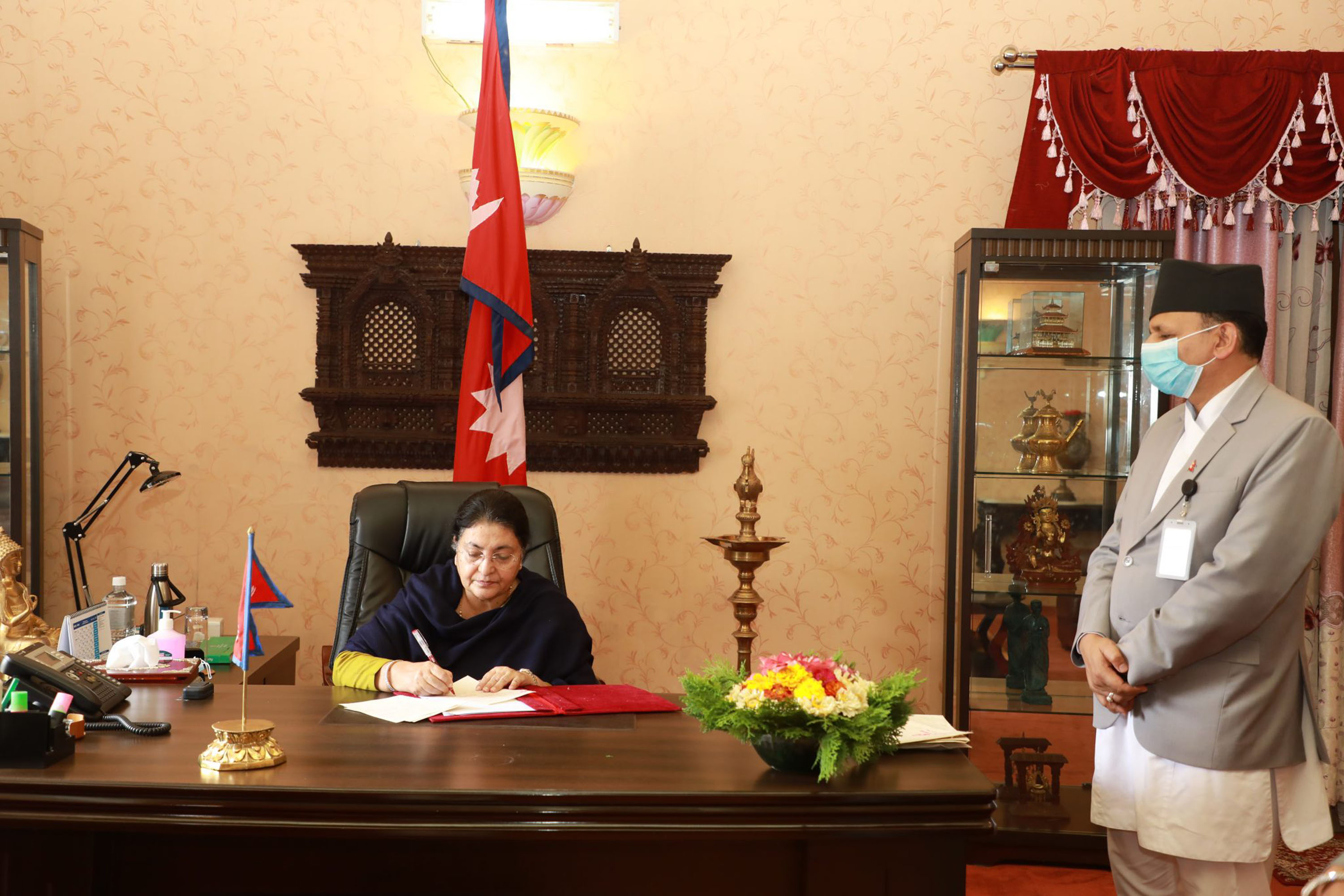 President Bhandari and Li sit for courtesy meeting