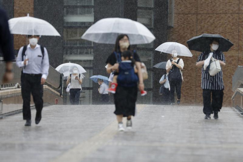 Tropical storm dumps rain on northern japan, disrupts Olympics