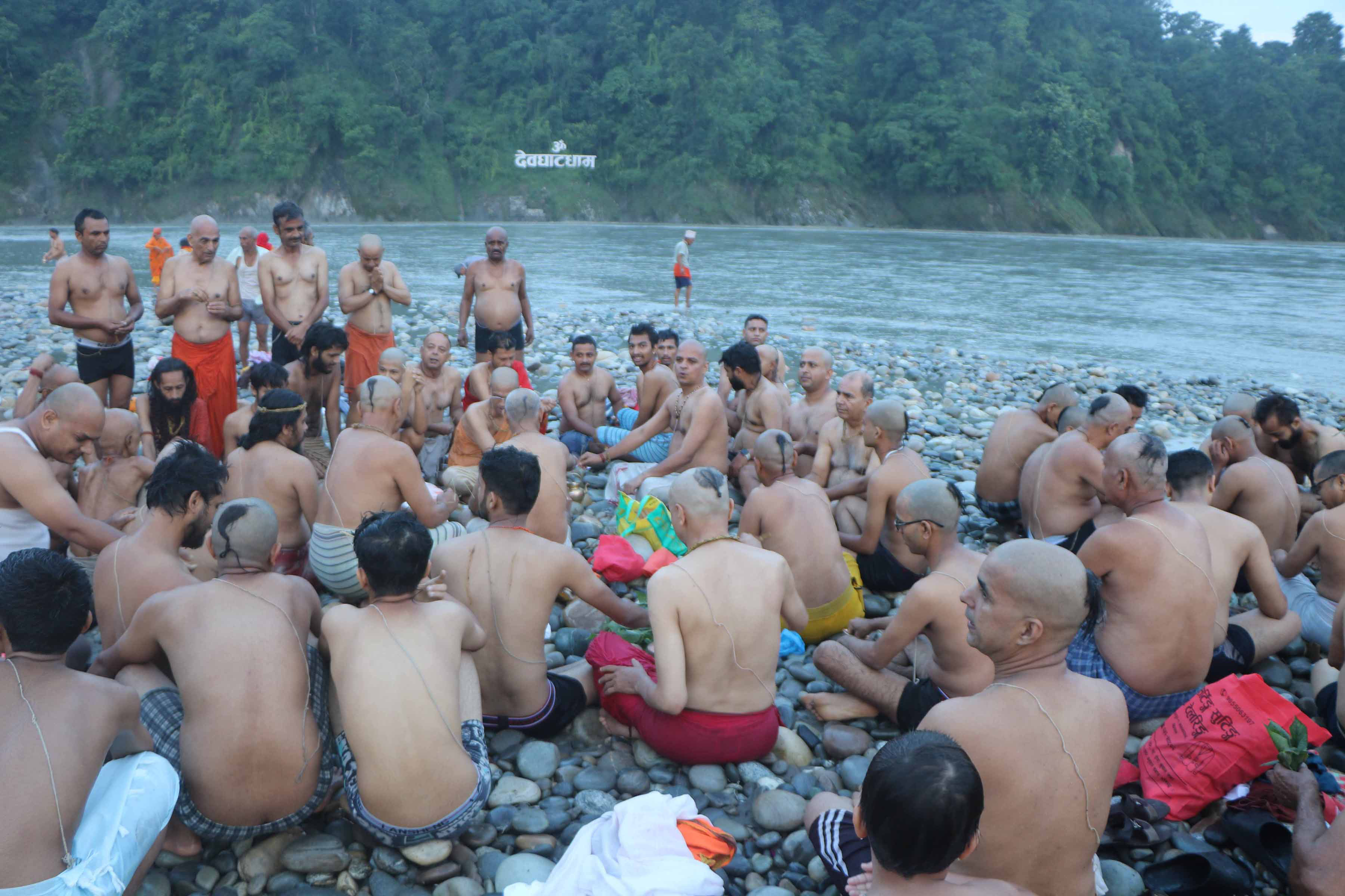 Taking Shravani bath at Devghat