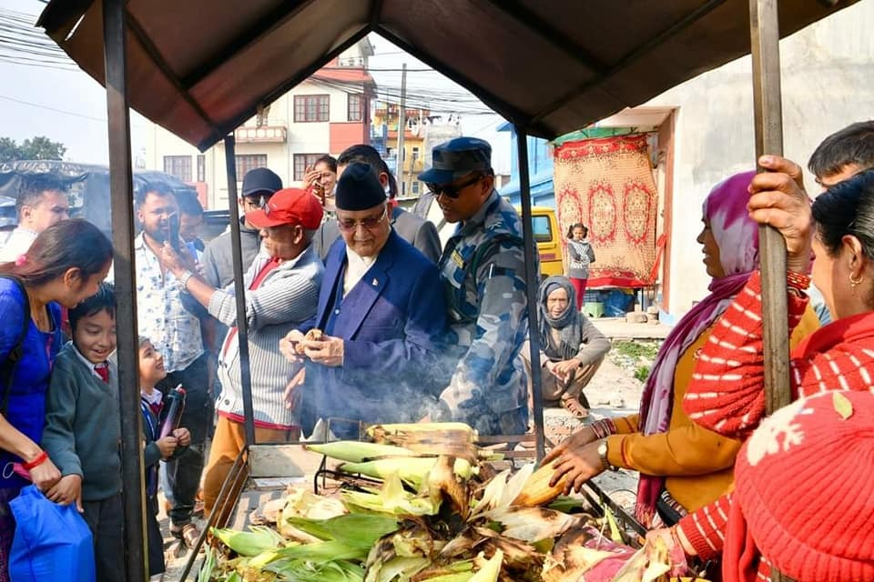 Chairman Oli eating corn