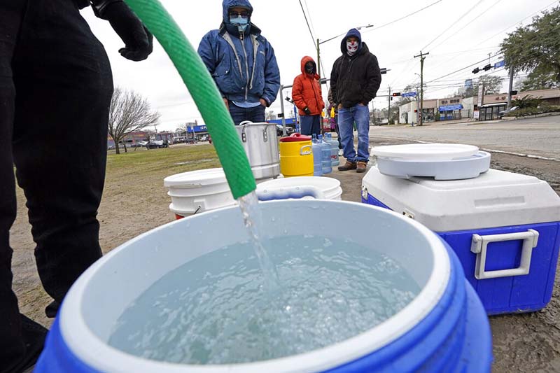 Lights come back on in Texas as water woes rise in the South