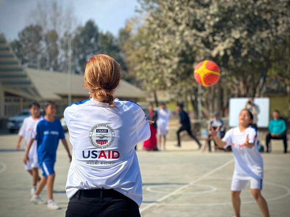 Administrator Power plays basketball with students