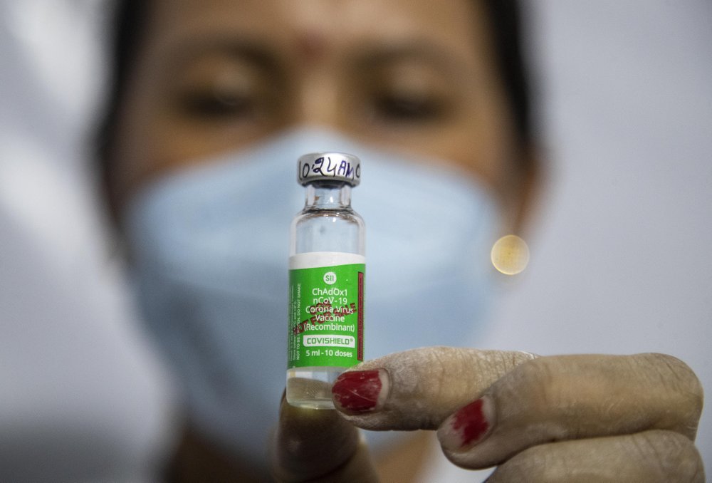 India fights virus surge, steps up jabs amid export row