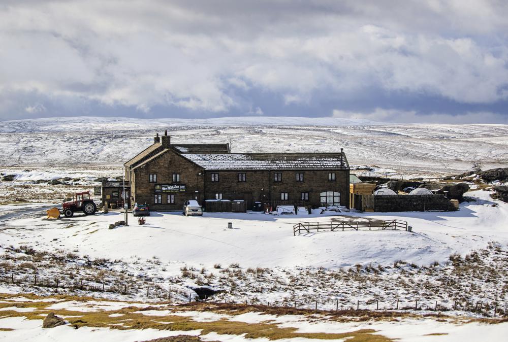 Dozens trapped in England’s highest pub after storm