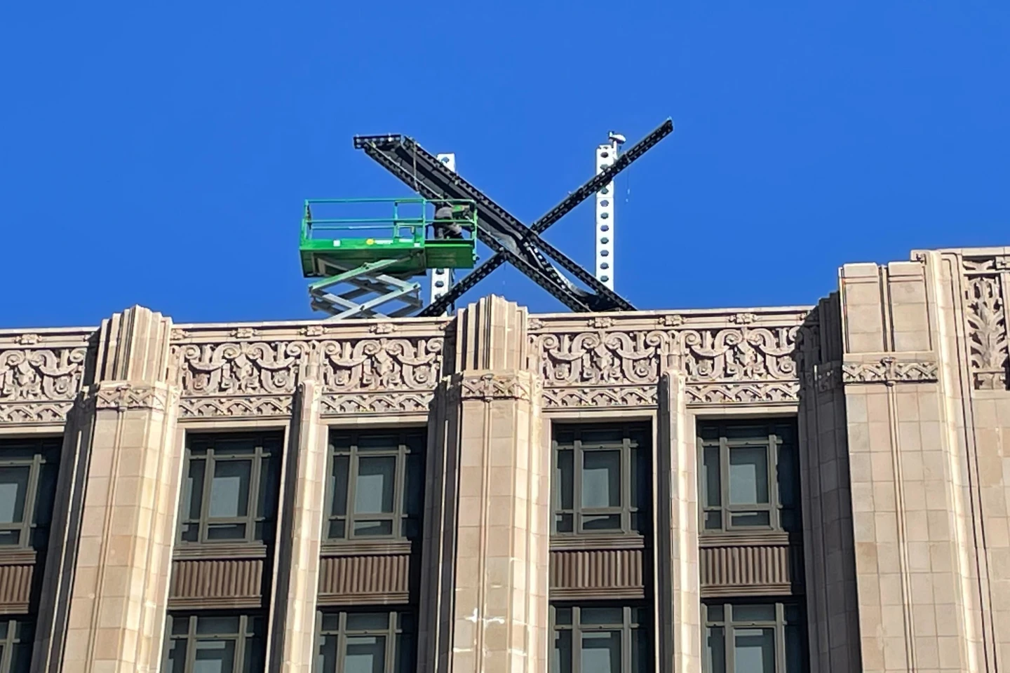 ‘X’ logo installed atop Twitter building