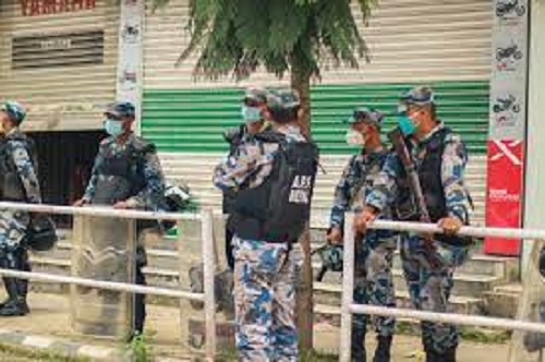 Armed police control truck with luggage