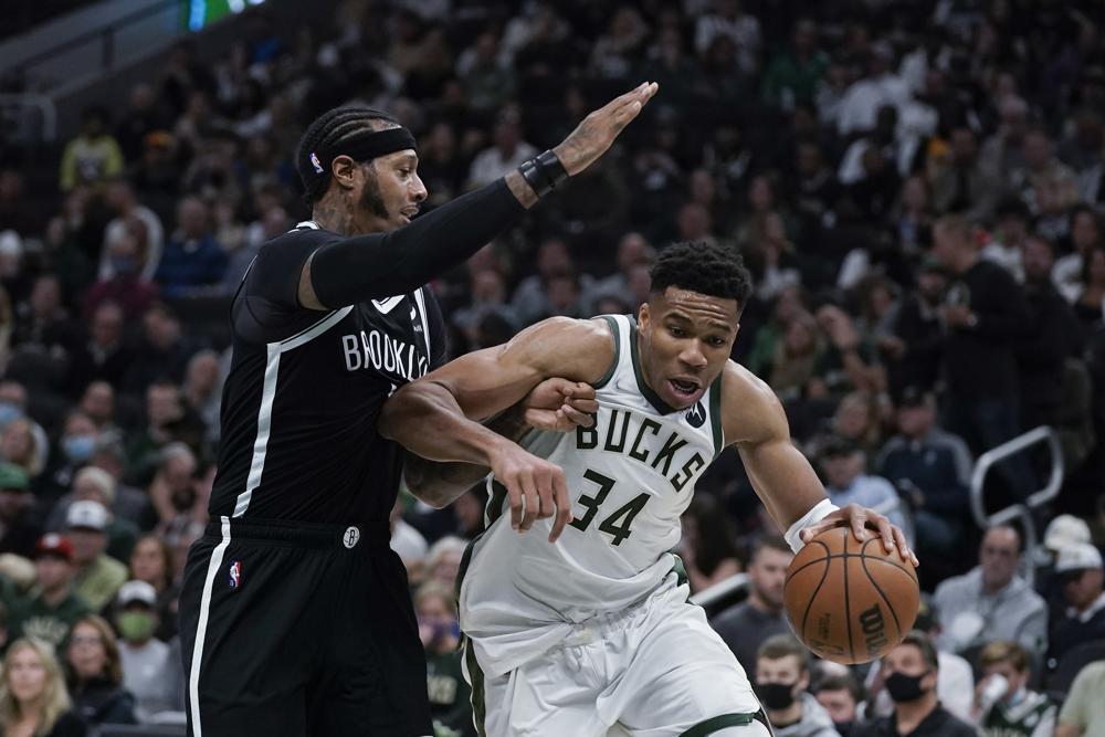 Bucks begin title defense with 127-104 victory over Nets