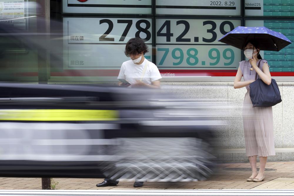 Asian shares slide after Fed rate comments