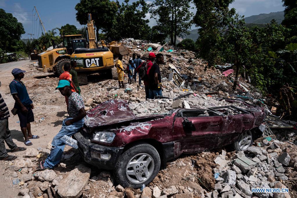 Cleanup begins of Haiti town’s earthquake-crumbled homes