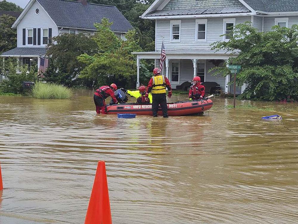 Henri hurls rain as storm settles atop swamped Northeast