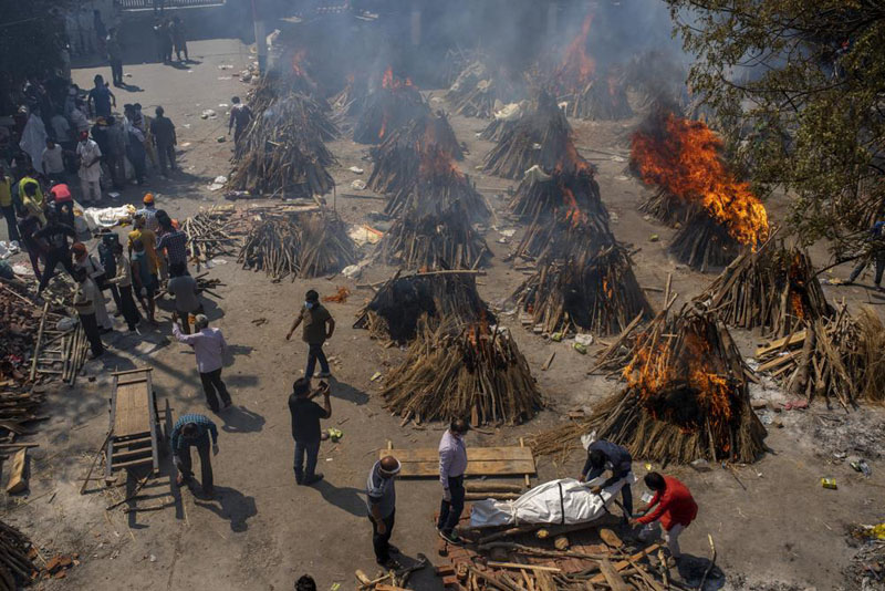 India’s crematoriums overwhelmed as virus ‘swallows people’