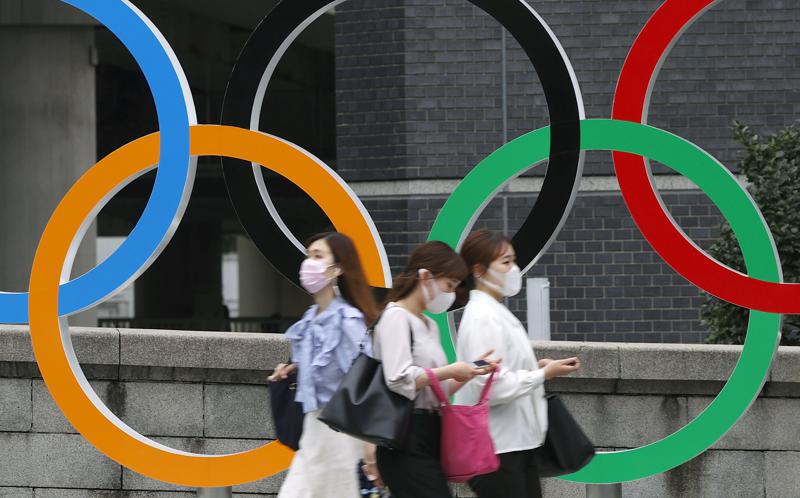 Japan to declare virus emergency lasting through Olympics