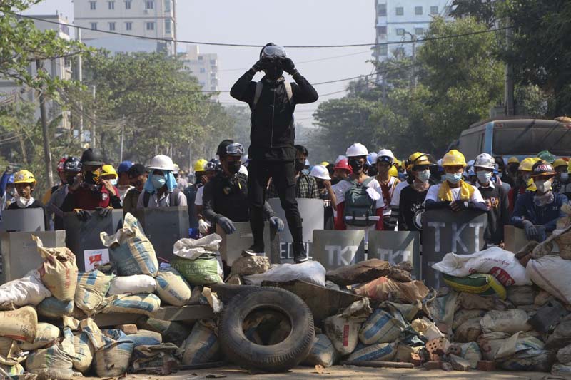 Myanmar crisis heightens with police raids and strike call