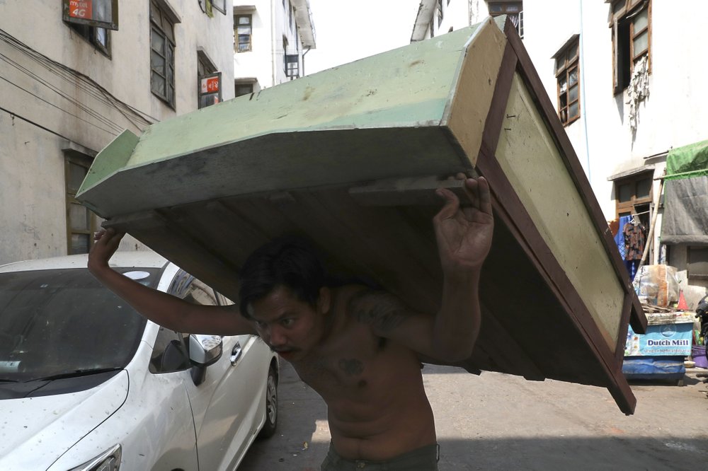 Striking Myanmar rail workers move out as protests continue