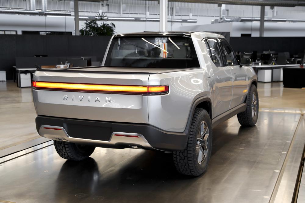 With high-profile backers, EV startup Rivian goes public