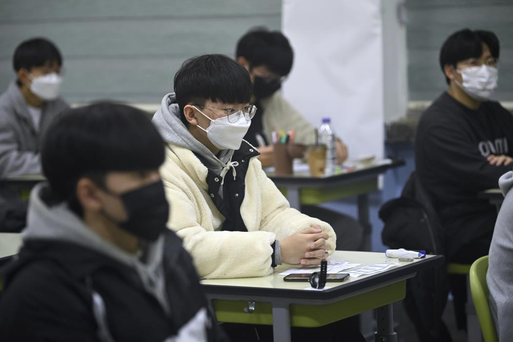 South Korea sees record virus jump as thousands take college exam