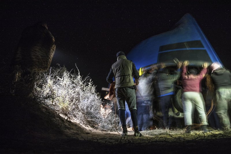 Boats emerge from Sahara sand to transport migrants to Spain