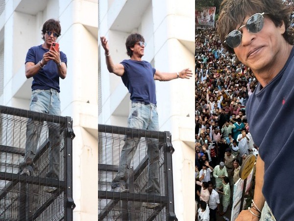 SRK strikes his iconic pose for fans on Eid