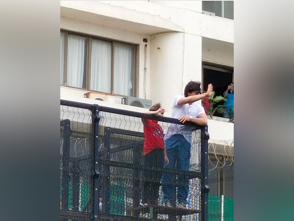 Shah Rukh Khan, AbRam wave at fans on Eid-ul-Adha