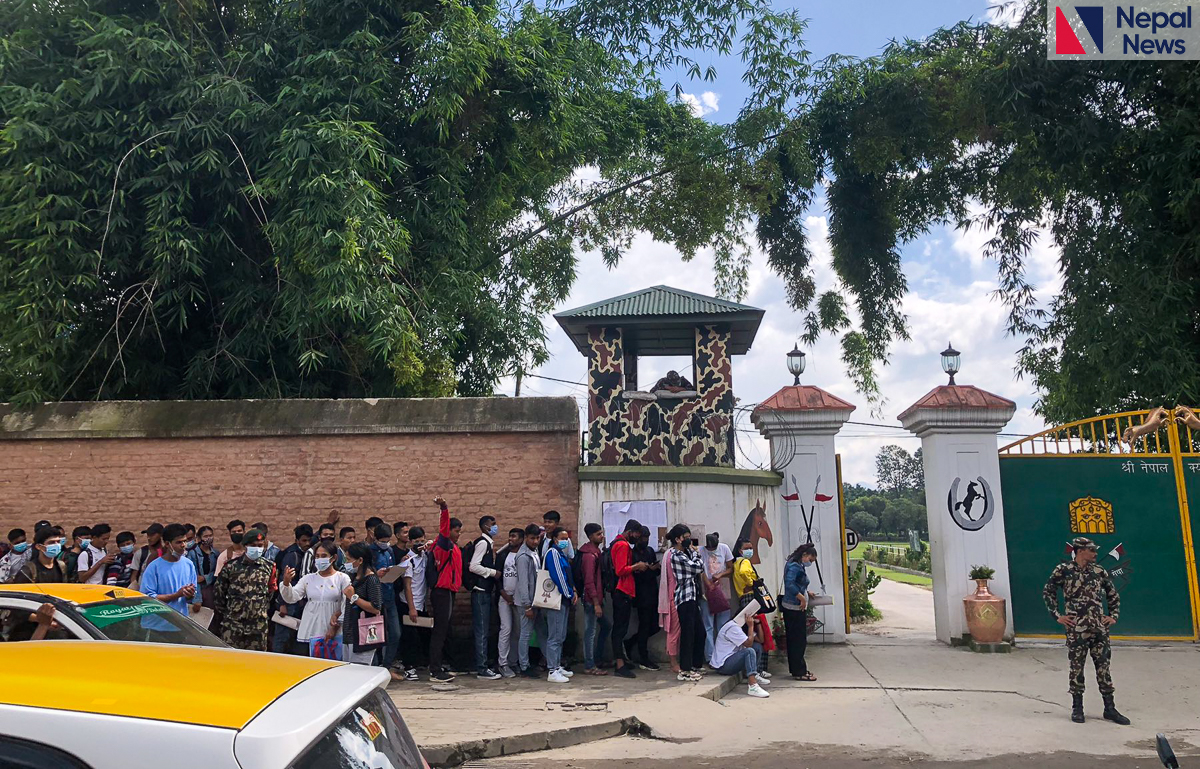 Applicants line up in front of Army Barracks