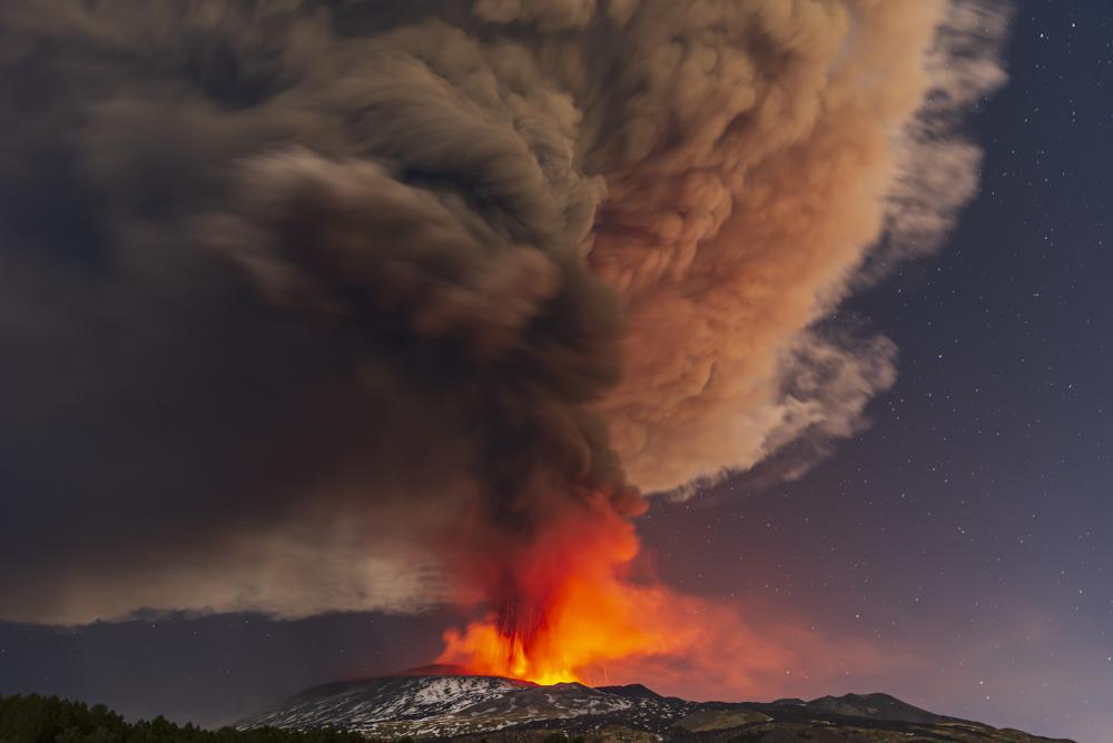 Volcanic lightning streaks sky over fiery Mount Etna